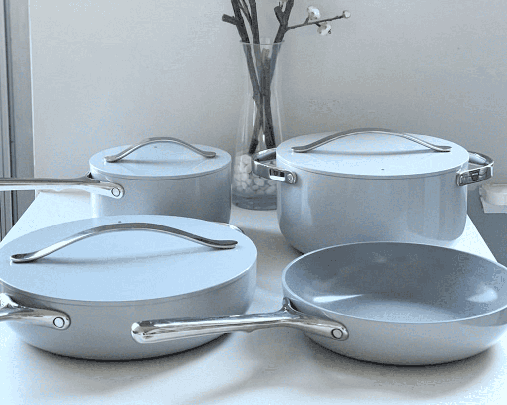 4-piece caraway grey cookware set on white background.
