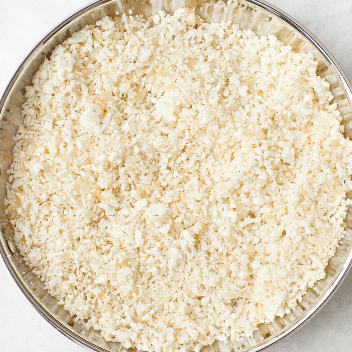 After tossed, before cooking.