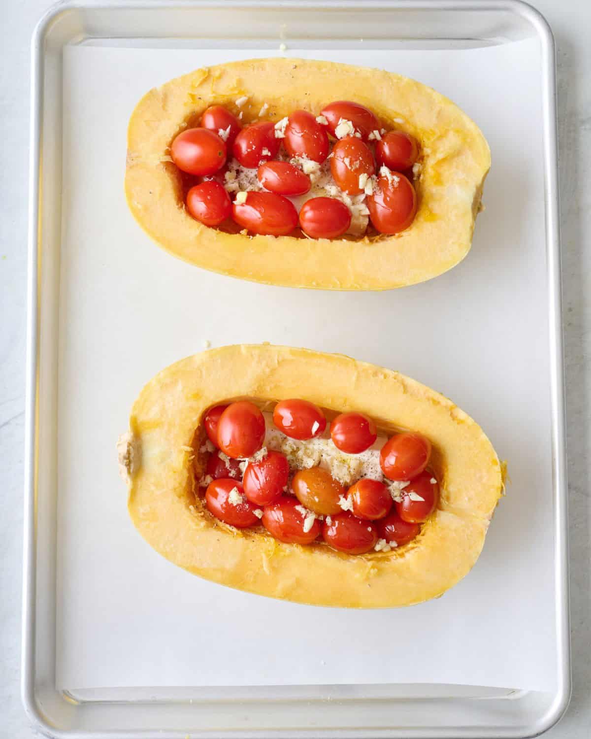 Tomatoes added on top of the feta cheese in the spaghetti squash.