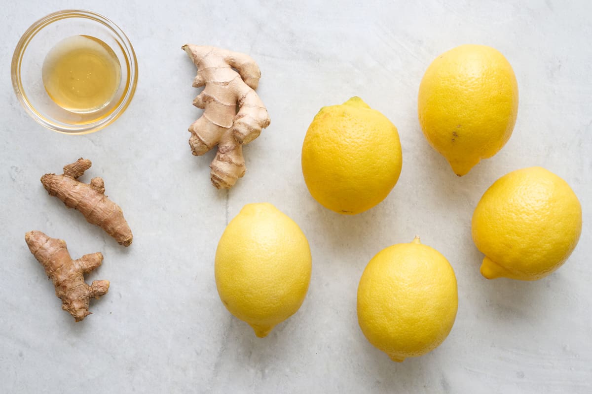 Ingredients for ginger shots: Ginger, turmeric, lemon, and honey.