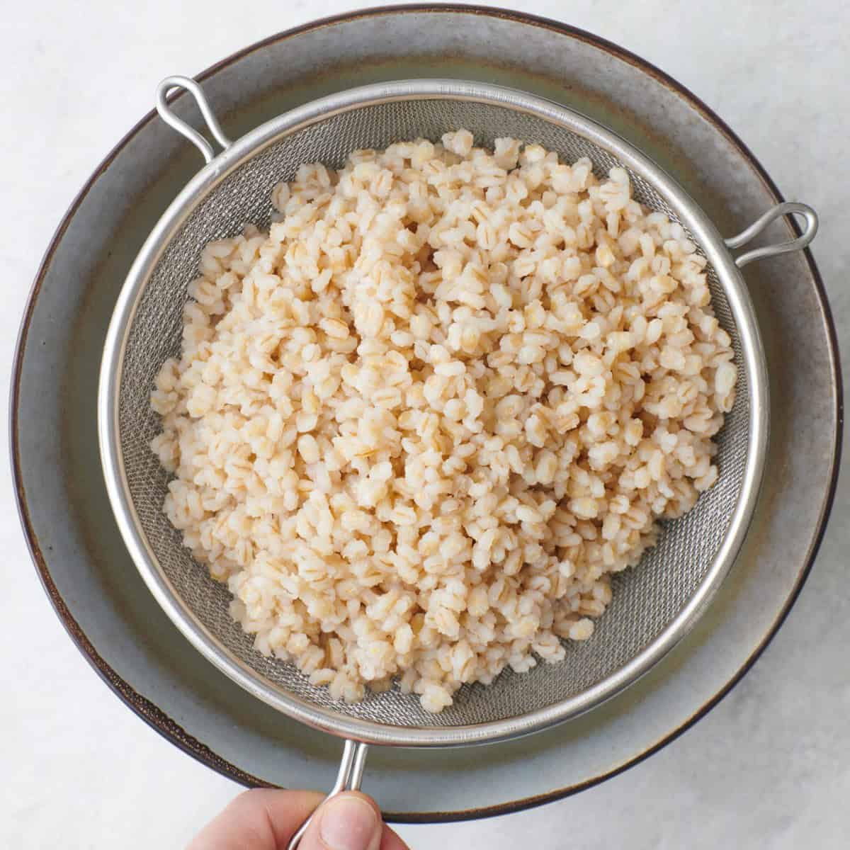 Barley in a strainer.
