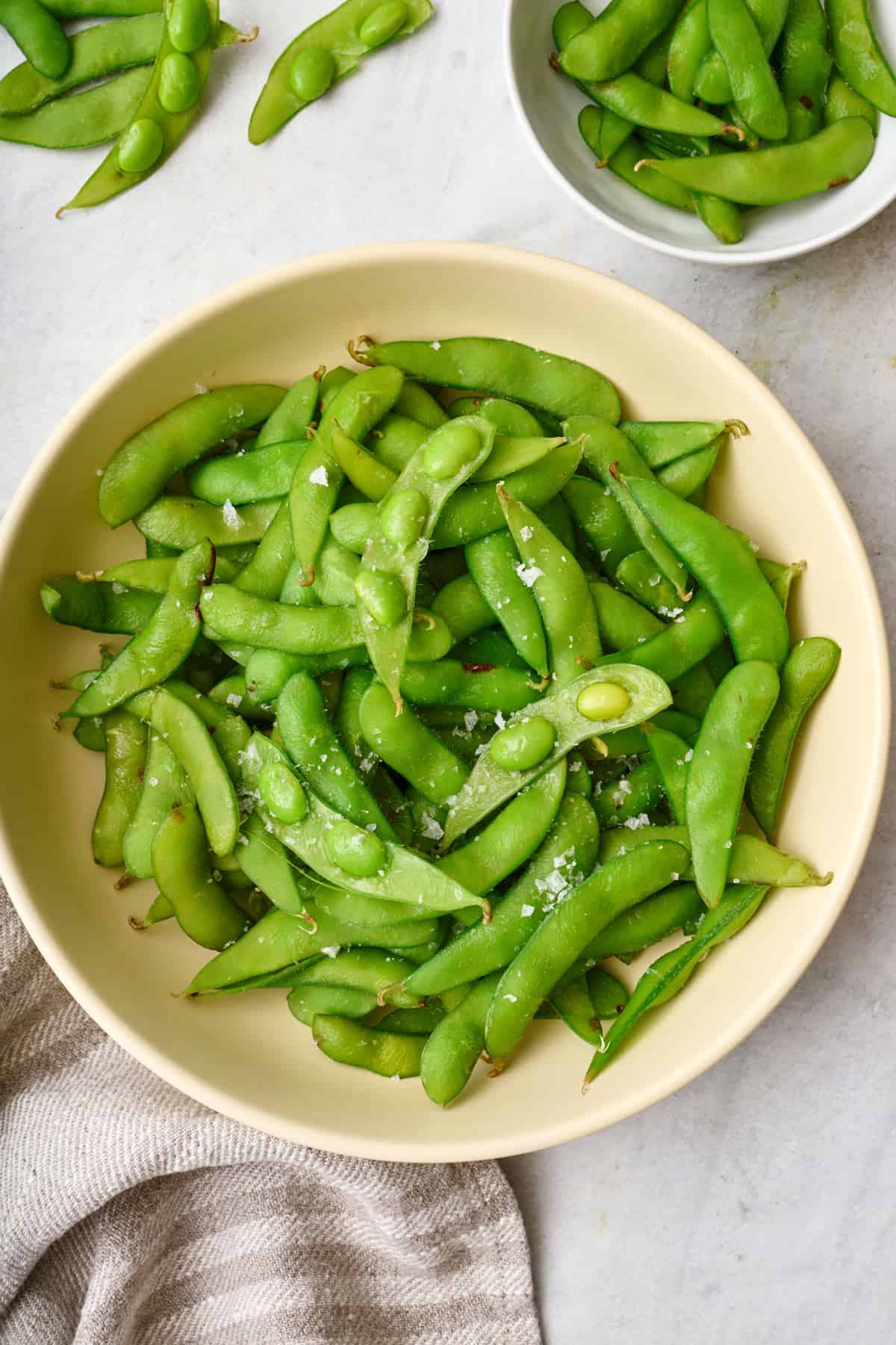 Cooked edamame pods in a bowl.