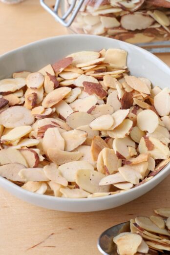 Bowl of toasted sliced almonds.