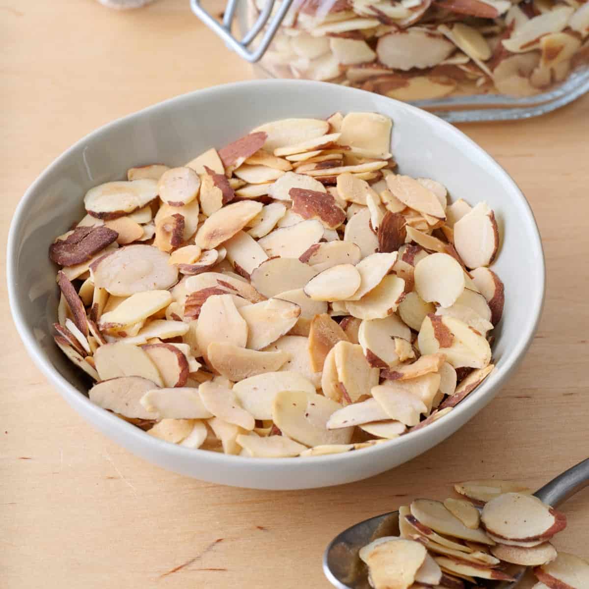 Bowl of toasted sliced almonds.