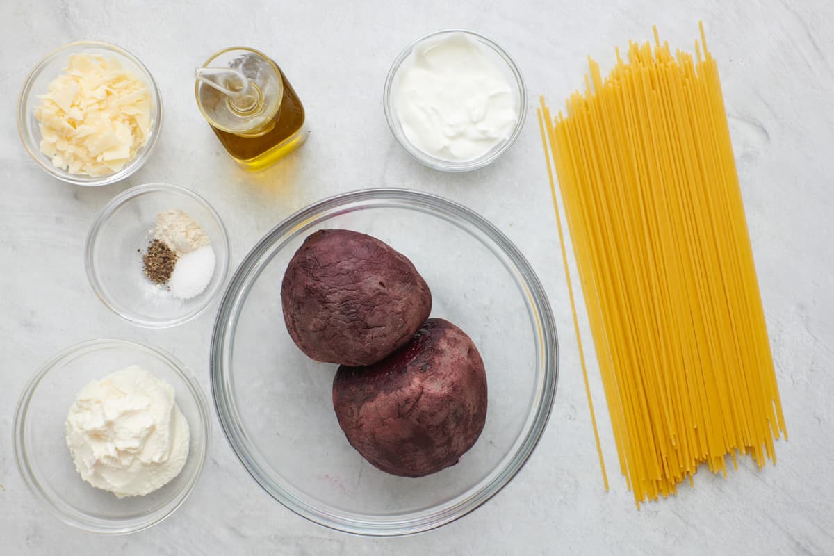 Ingredient for recipe: shredded parmesan, seasonings, ricotta, Greek yogurt, roasted beets, and dry spaghetti.