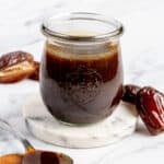 Homemade date syrup in jar.