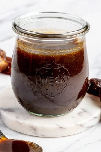 Homemade date syrup in jar.