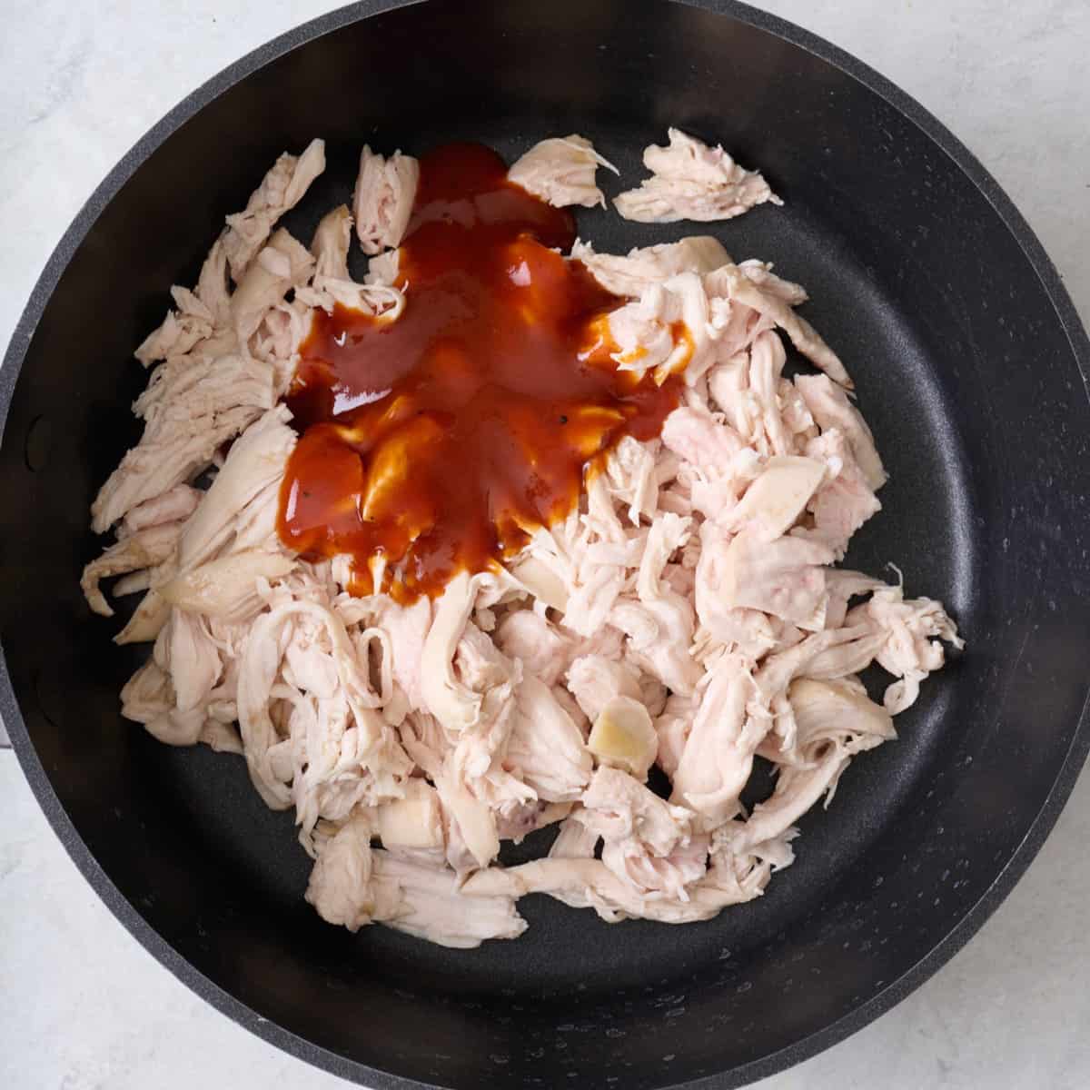 Bbq sauce on top of shredded chicken before combining.