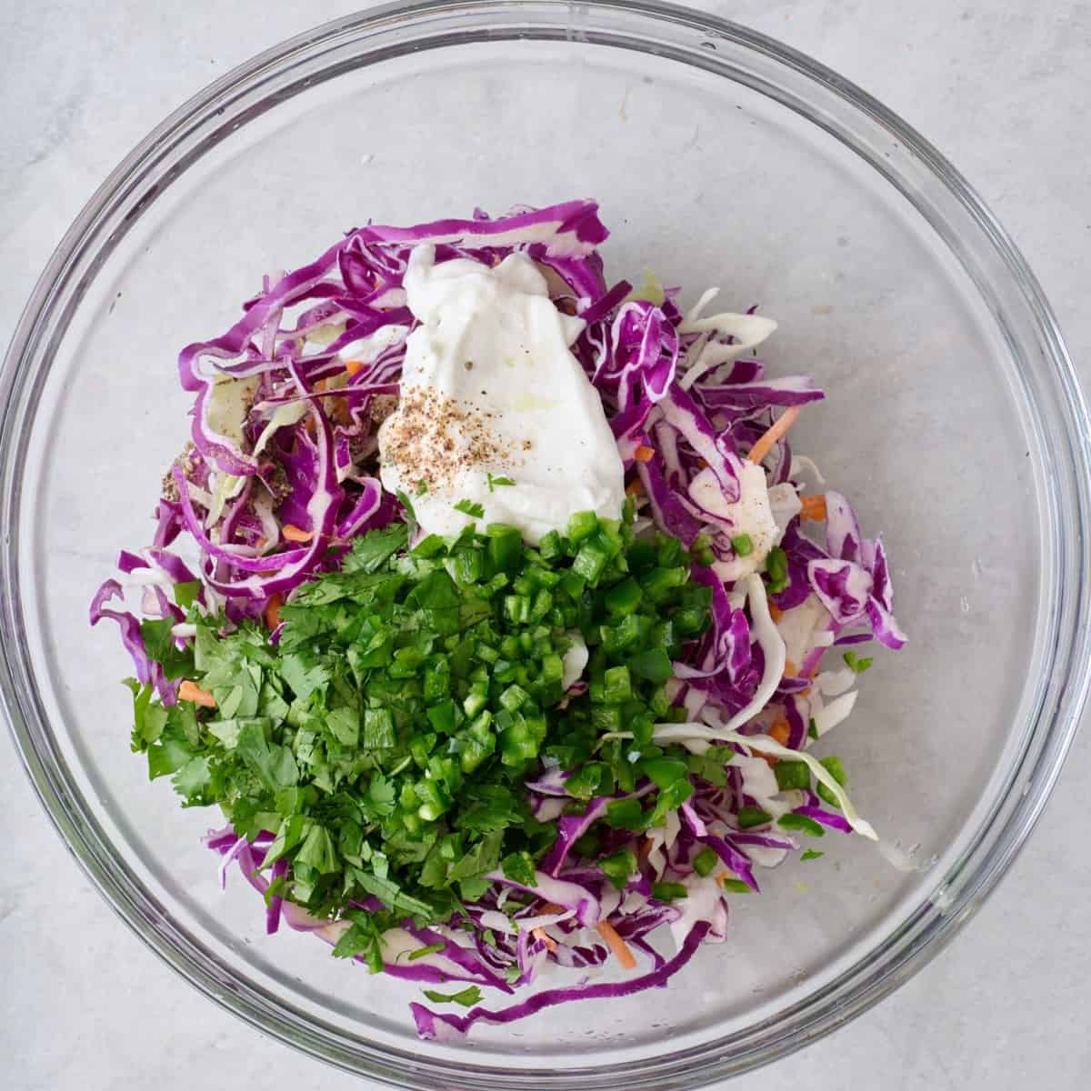 Ingredients for slaw in a bowl.