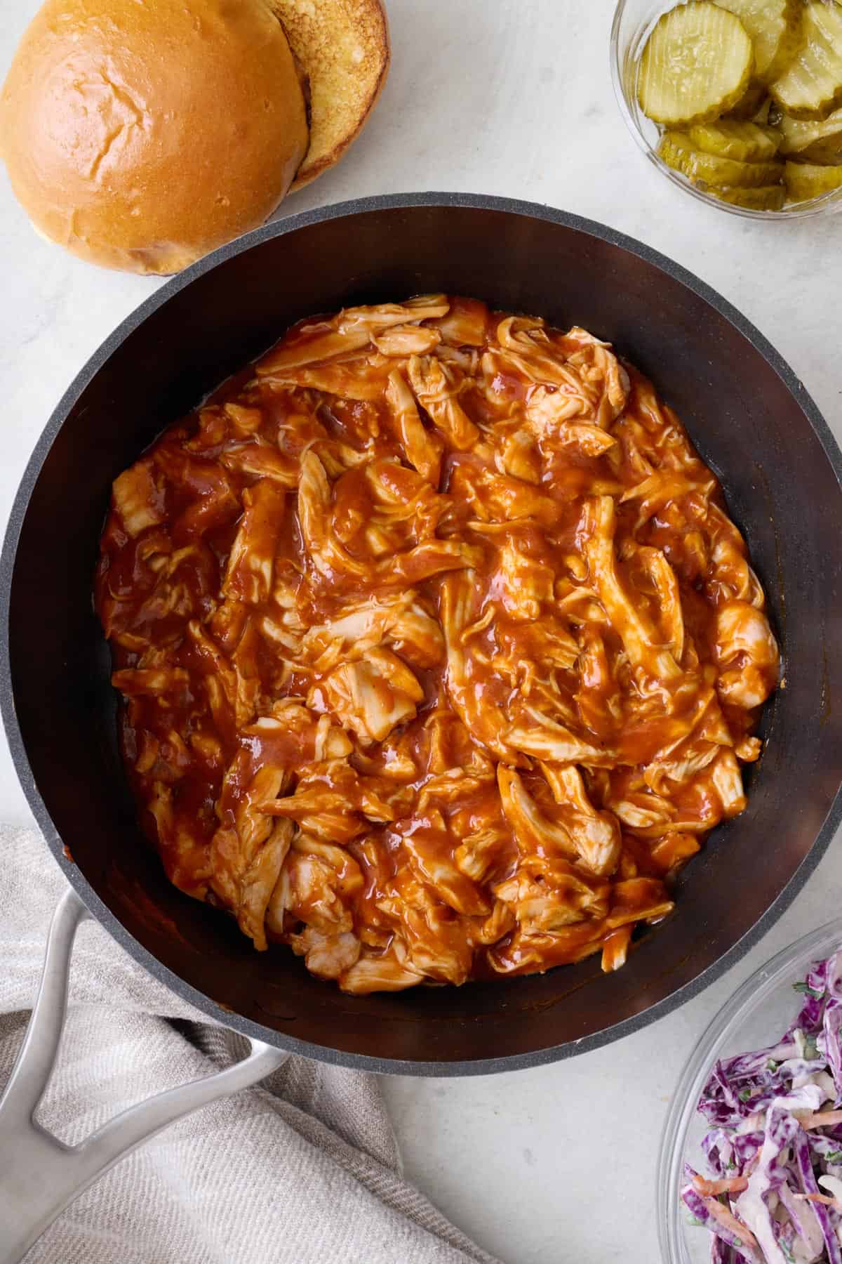 Shredded bbq chicken in a pot for sandwiches.