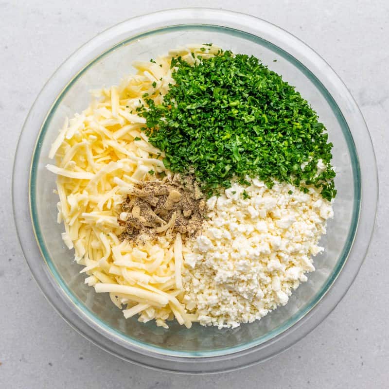 Filling ingredients in a bowl before mixing.