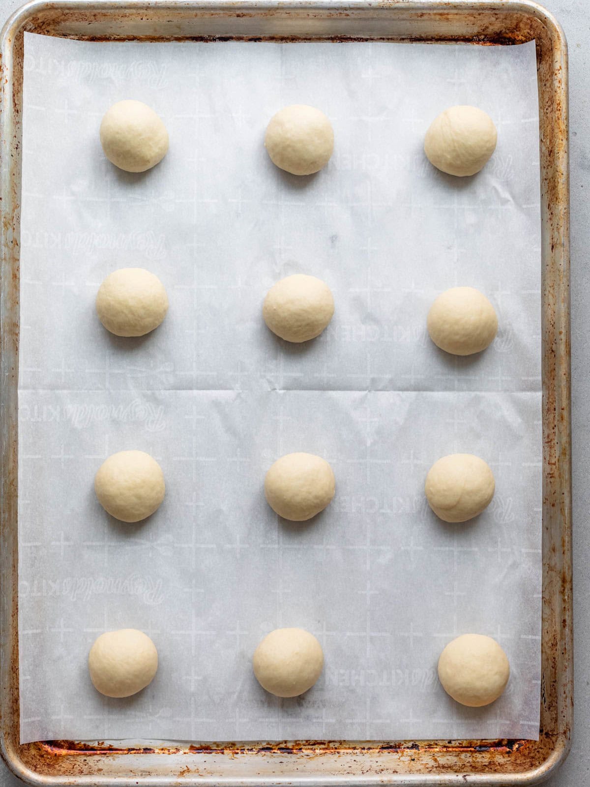 Balls of dough on baking sheet.