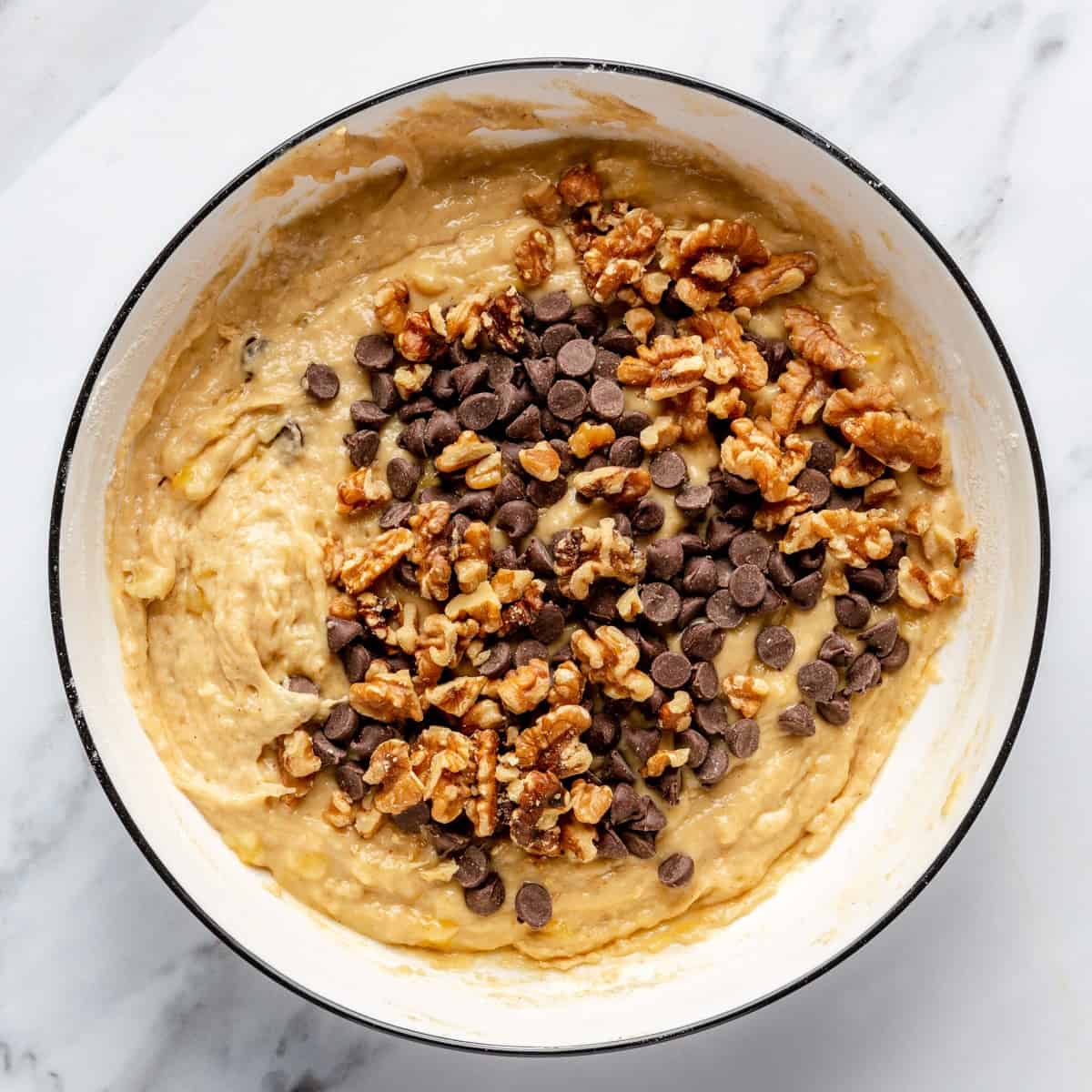 Batter in a bowl before mixing in the nuts and chocolate.