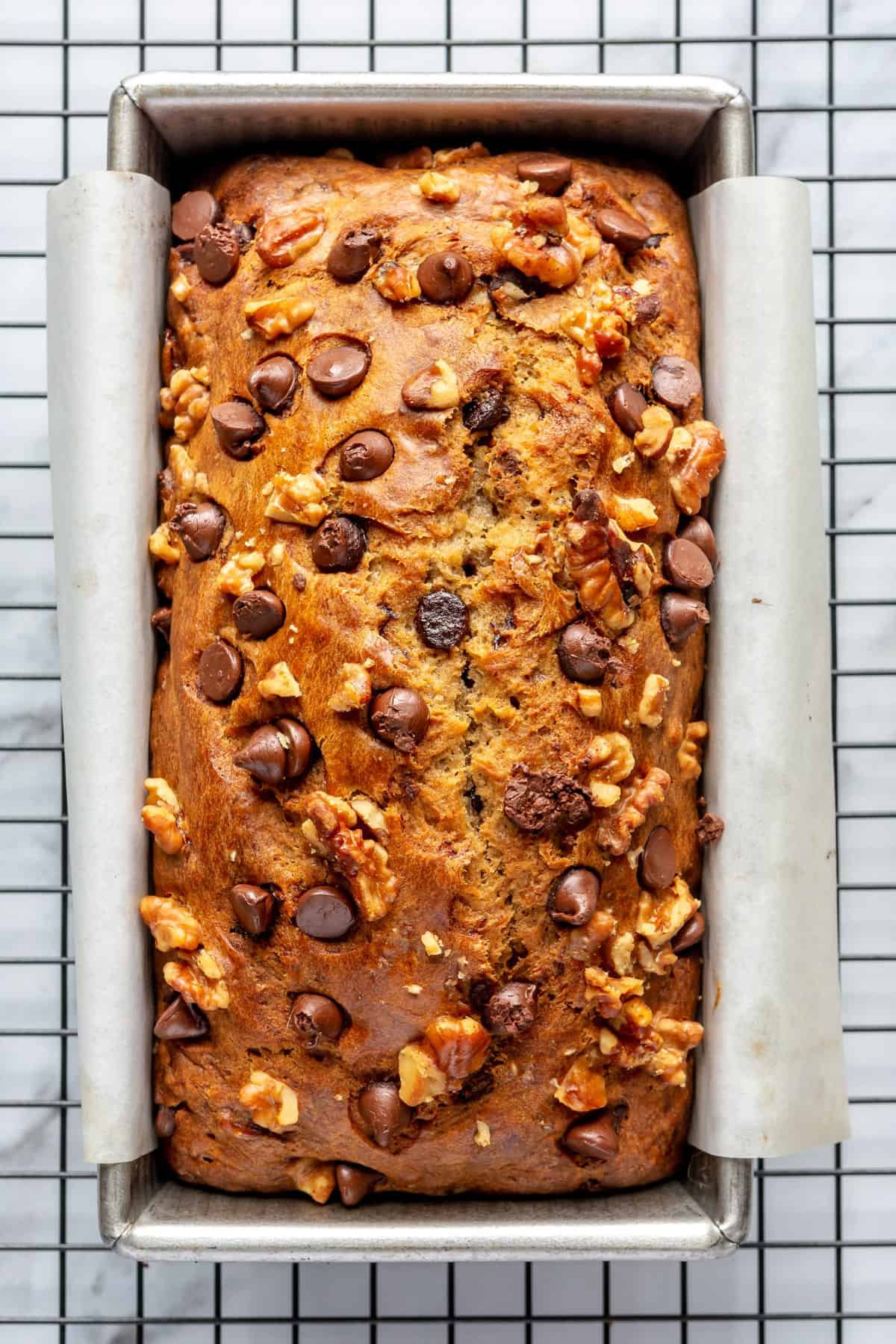 Baked bread in a loaf pan.