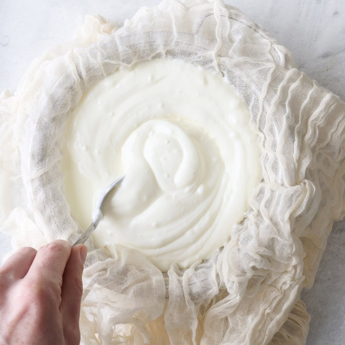 Gently stirring yogurt.