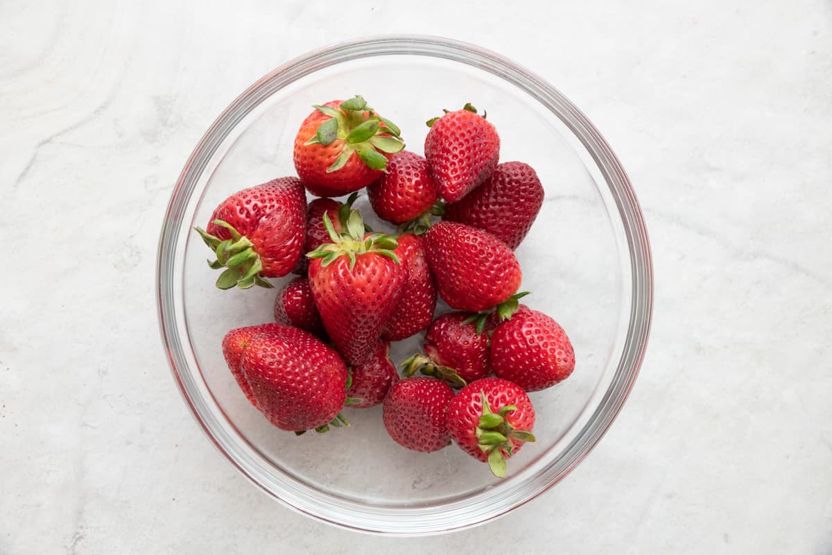 Bowl of fresh, whole strawberries.
