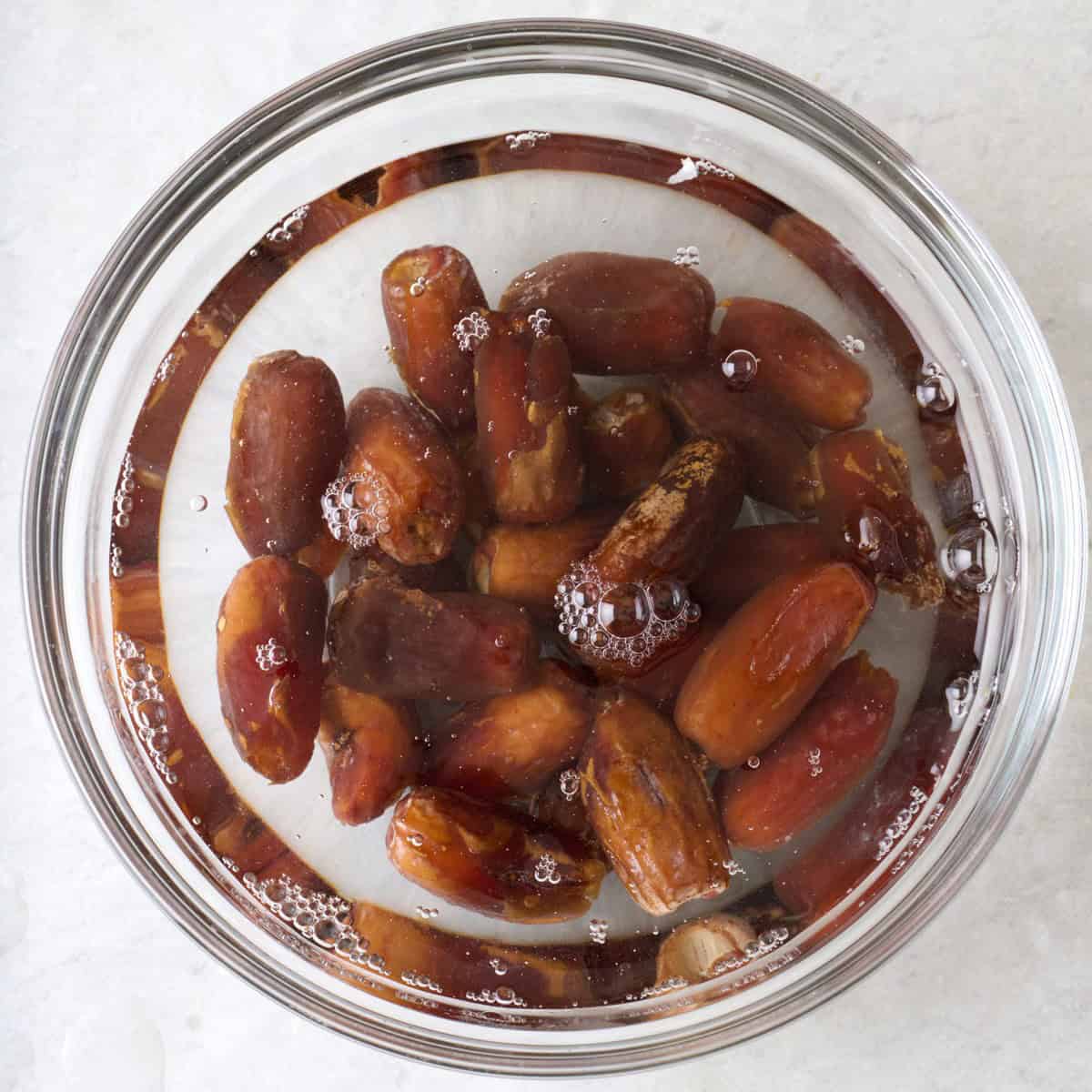 Dates in a bowl of water.