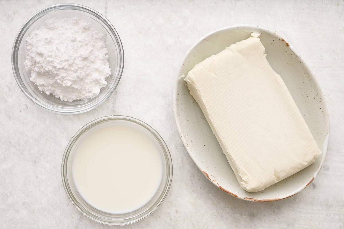 Ingredients for recipe: Cream cheese, whole milk, and powdered sugar.