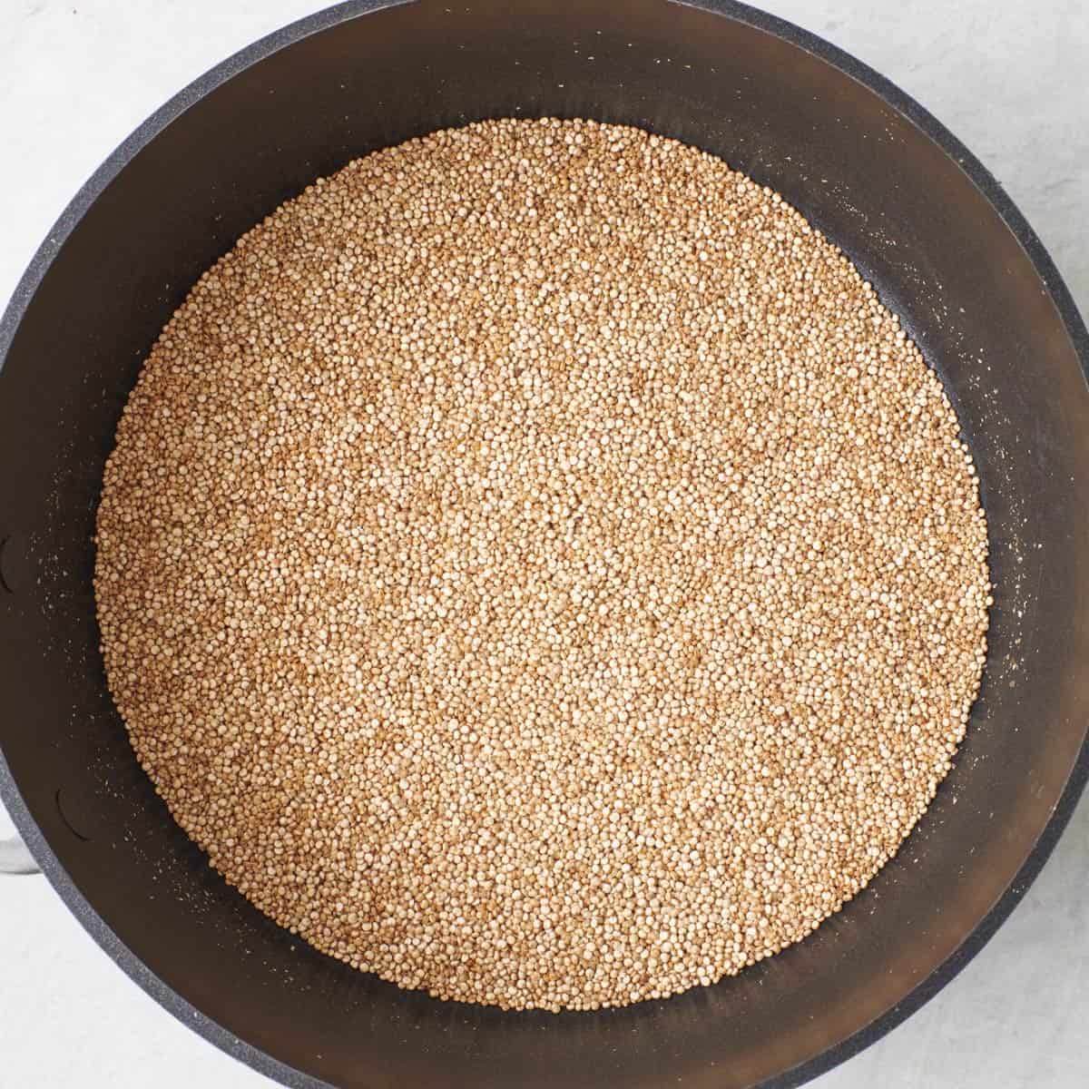 Quinoa in a dry skillet after toasting.