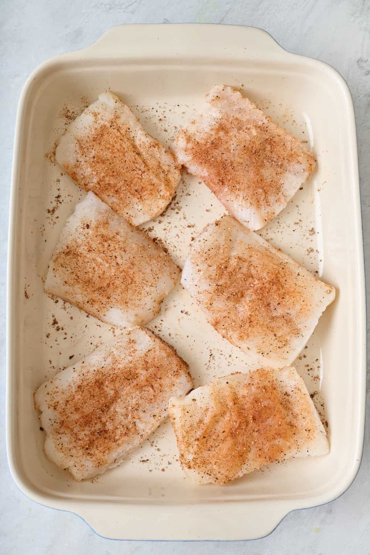 After seasoning with cumin, salt, pepper, and crushed red pepper on both sides.