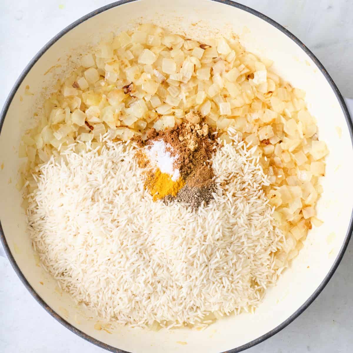 Rice and spices added on top before combining.