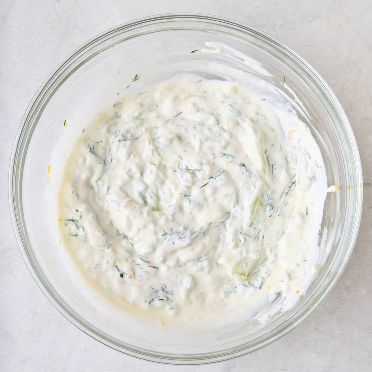 Tzatziki sauce in a bowl after combining.
