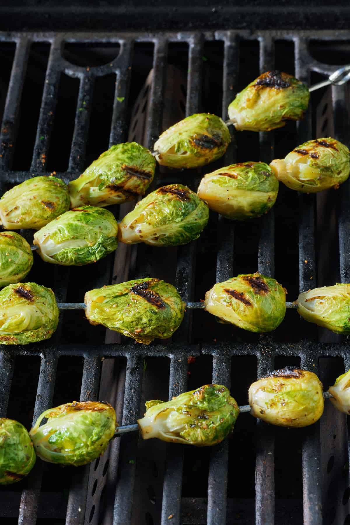 Brussels sprouts on skewers after grilling.