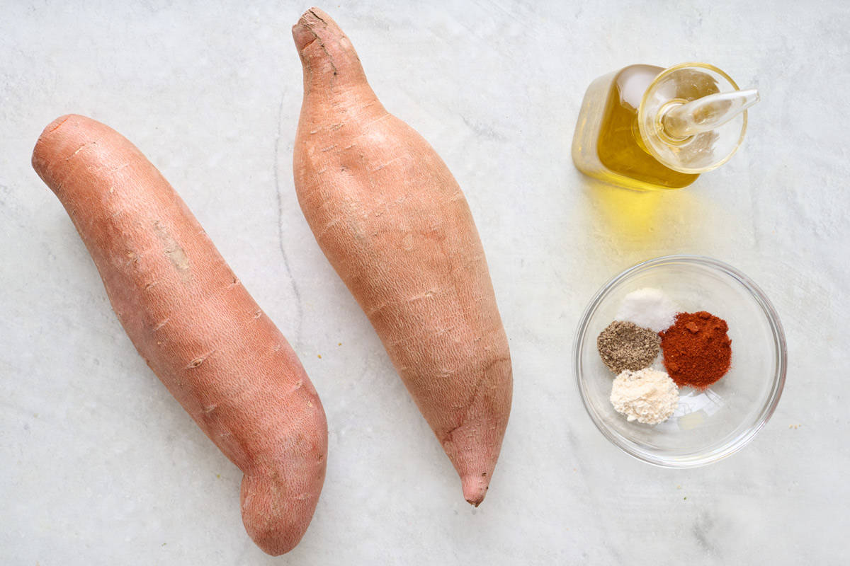 Ingredients for recipe: 2 long sweet potatoes, oil, and spices.
