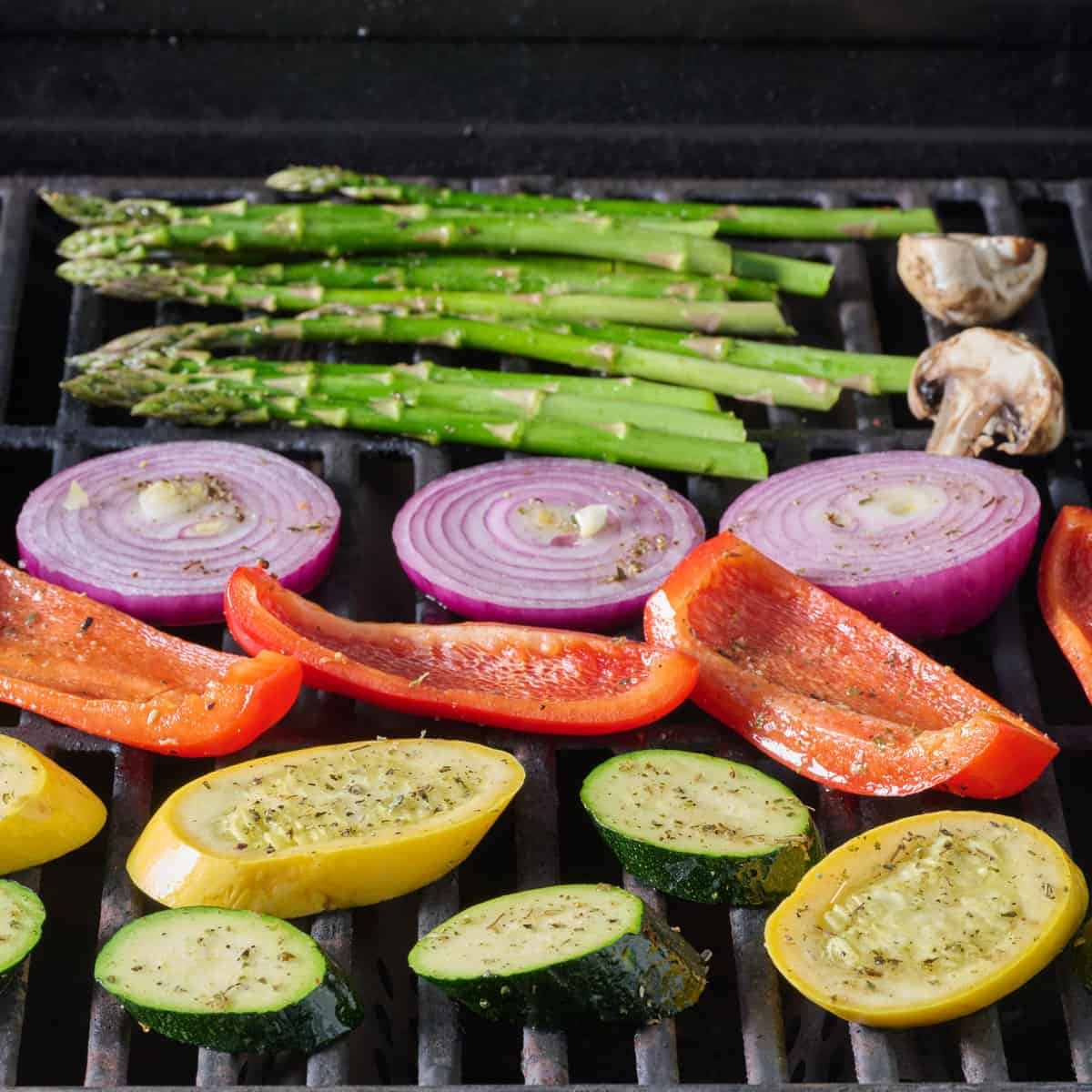 Seasoned veggies on a grill.