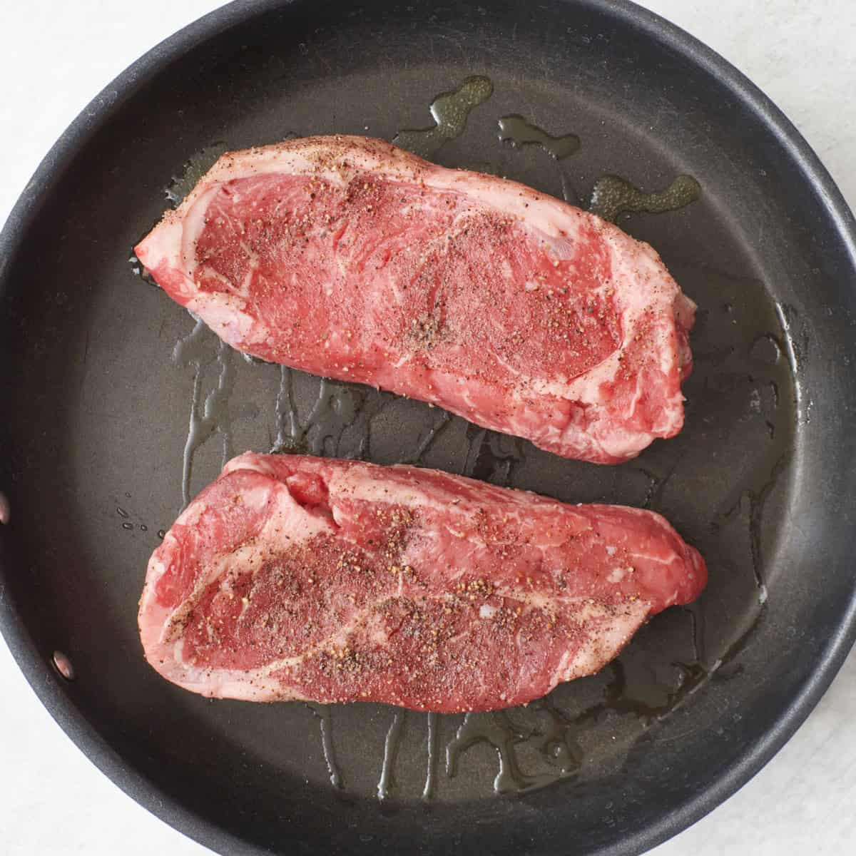 2 NY Strips on a non-stick skillet.