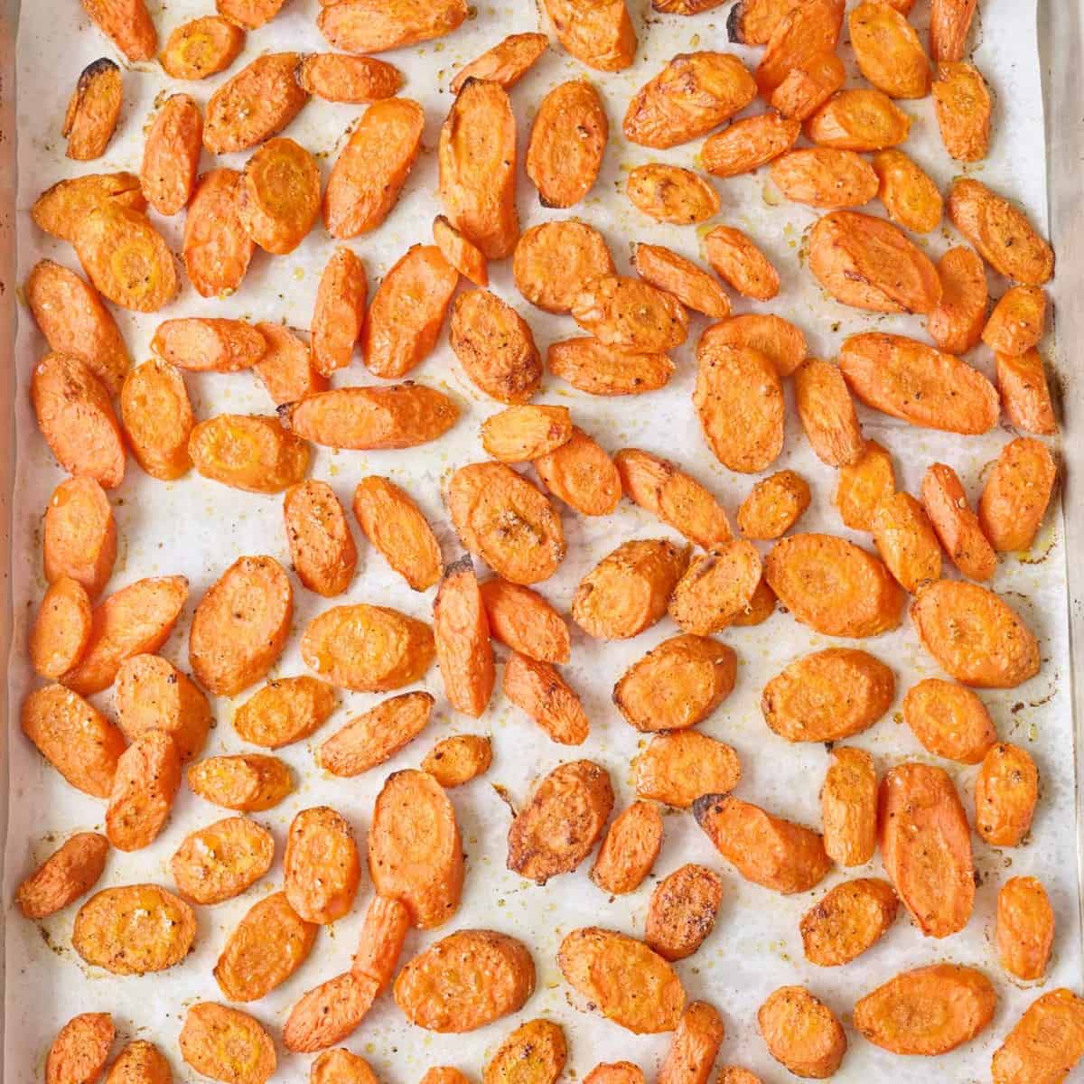 Carrots on a prepared sheet pan after roasting.