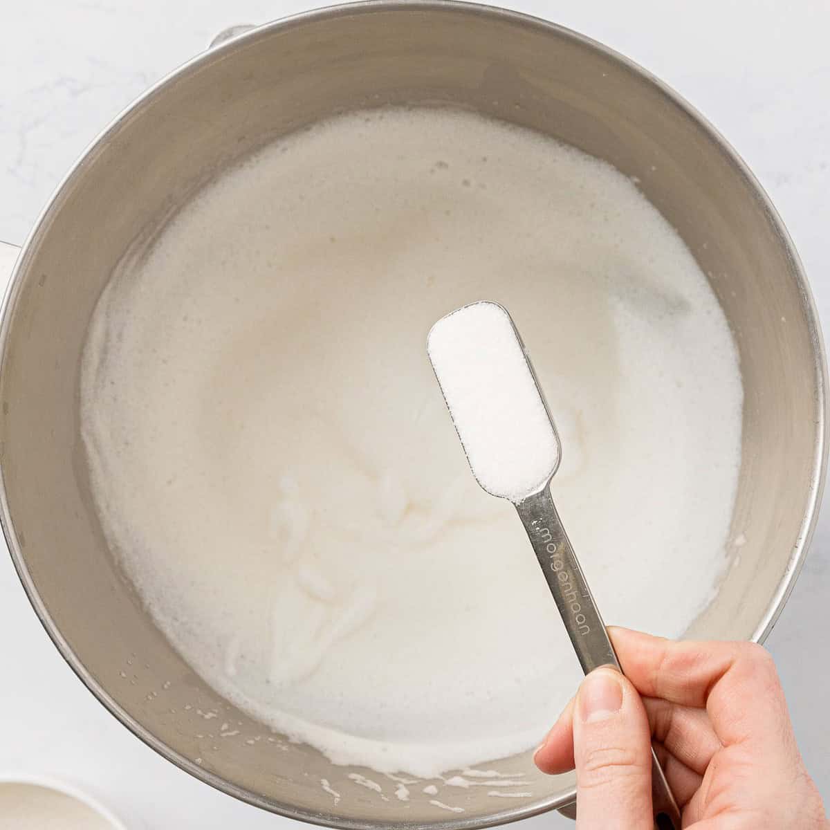 Sugar added to the bowl of batter.