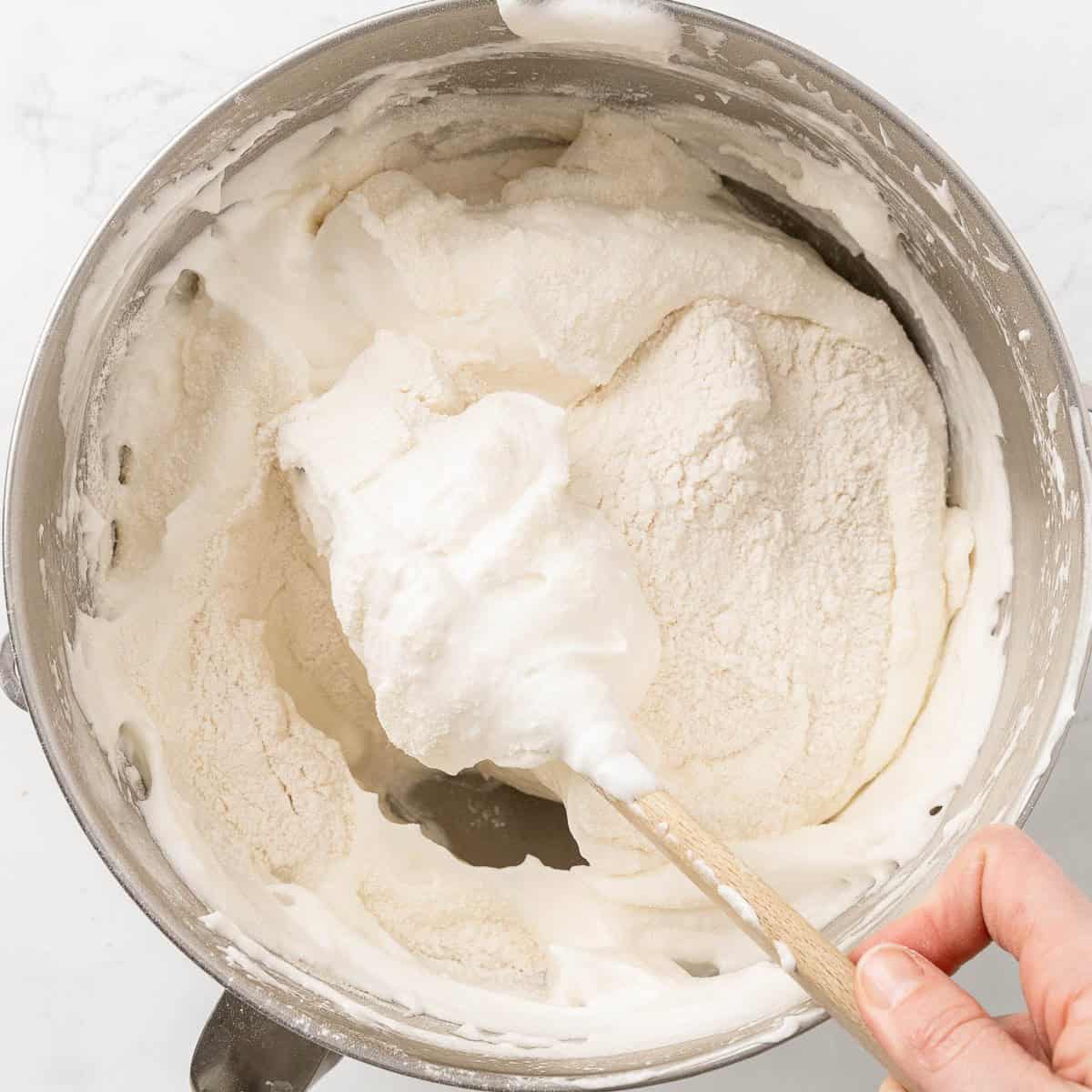 A spatula mixing batter.