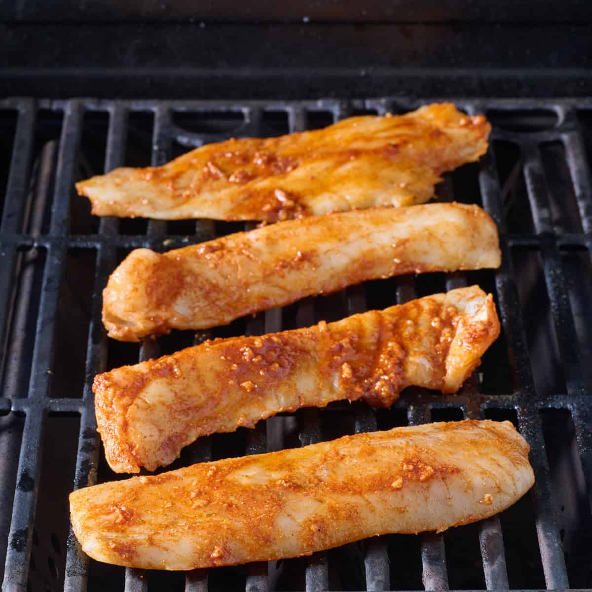 Fish fillets on a gas grill.