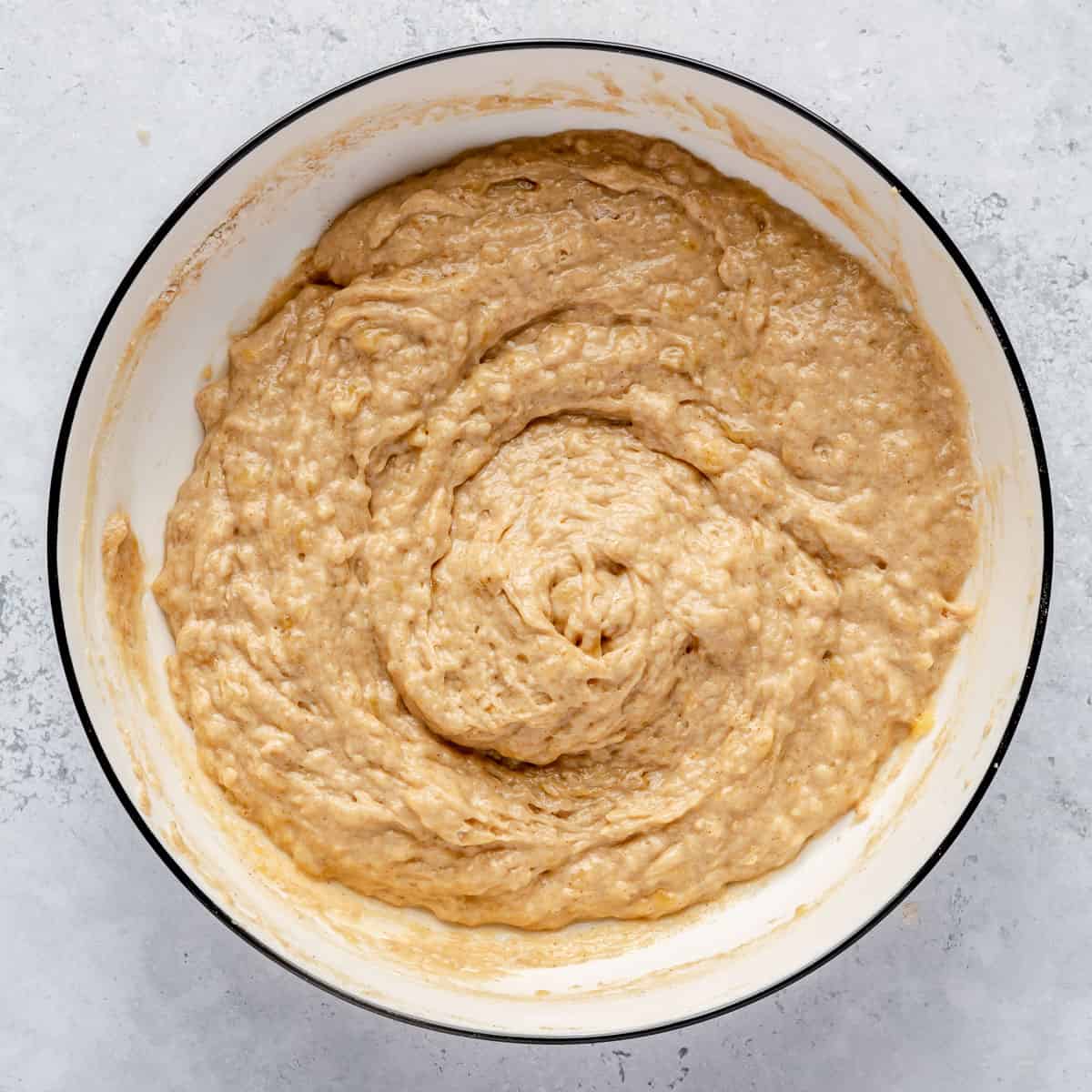 Mini banana muffin batter in a mixing bowl.