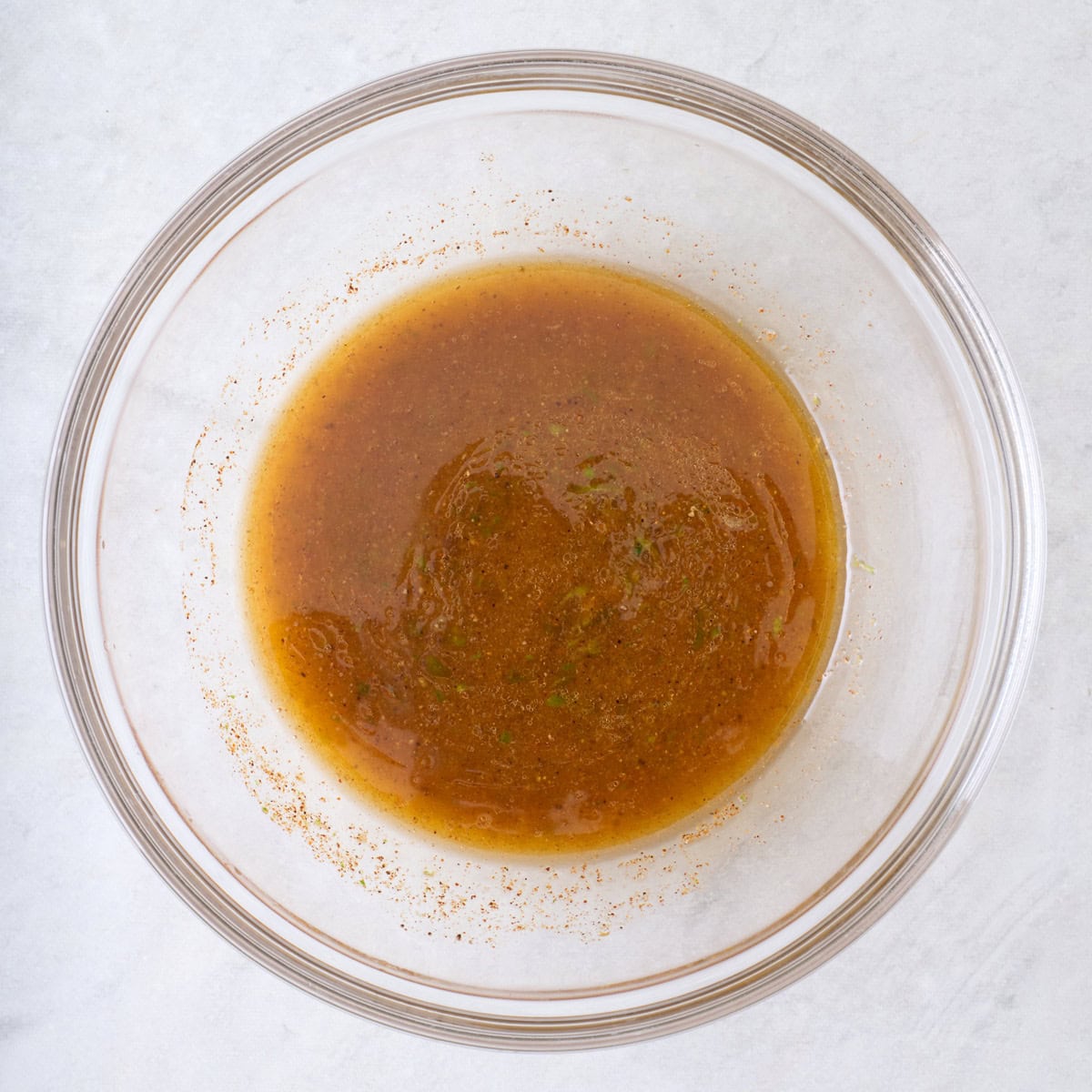 Mixed dressing in a mixing bowl.