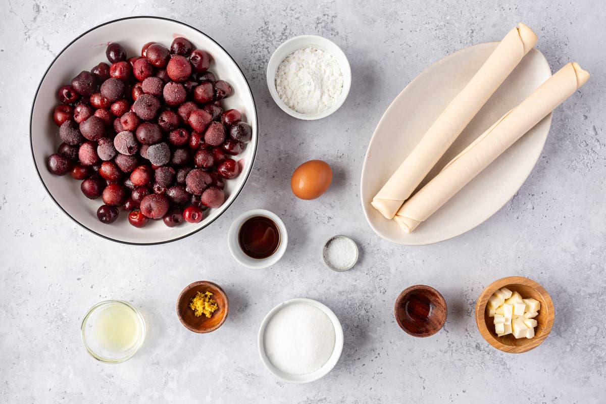 Cherry pie ingredients on a countertop.