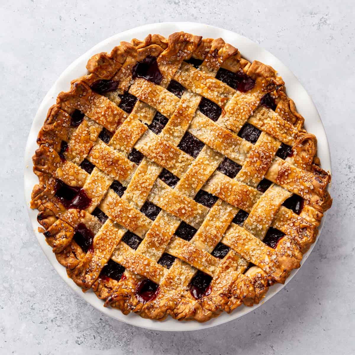 A baked cherry pie with a lattice crust.