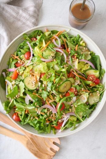 Mixed green salad in a serving bowl.