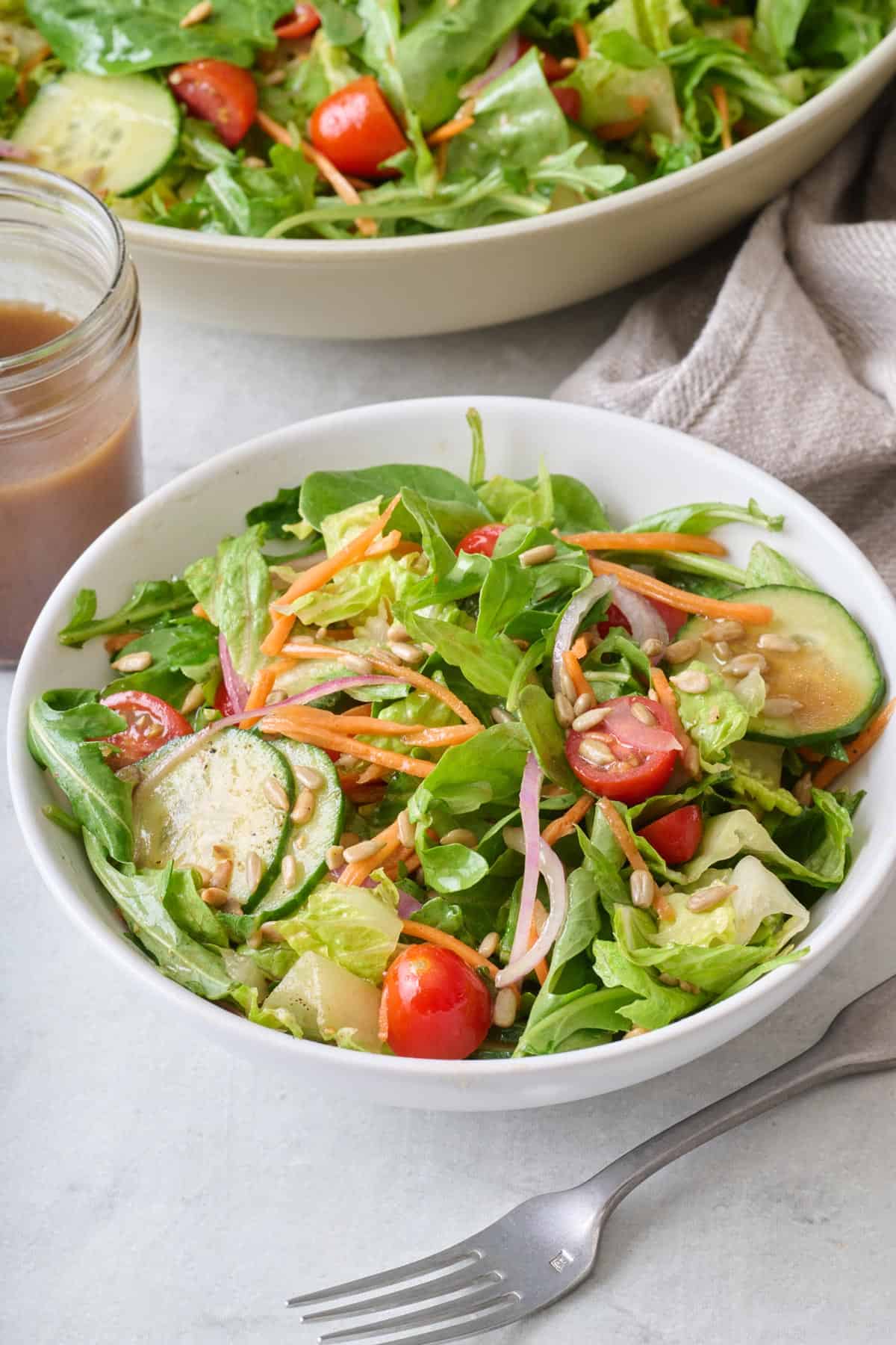 Mixed greens salad in a bowl.