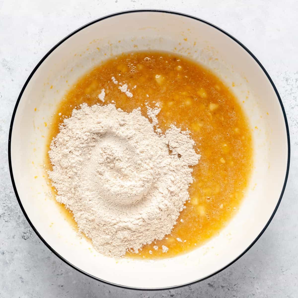 After wet ingredients combined, with dry flour mixture added on top and to the side.