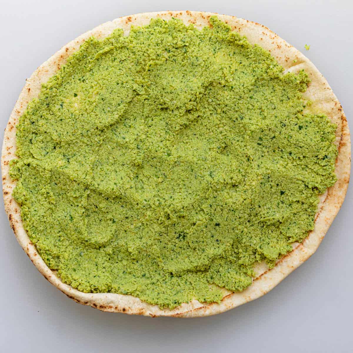 Falafel mixture spread on a pita.