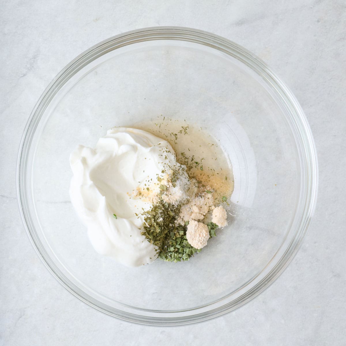 Greek yogurt and spices in a bowl.