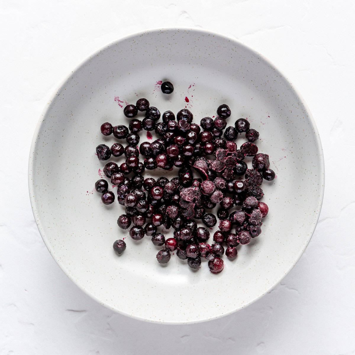 Bowl of frozen blueberries.