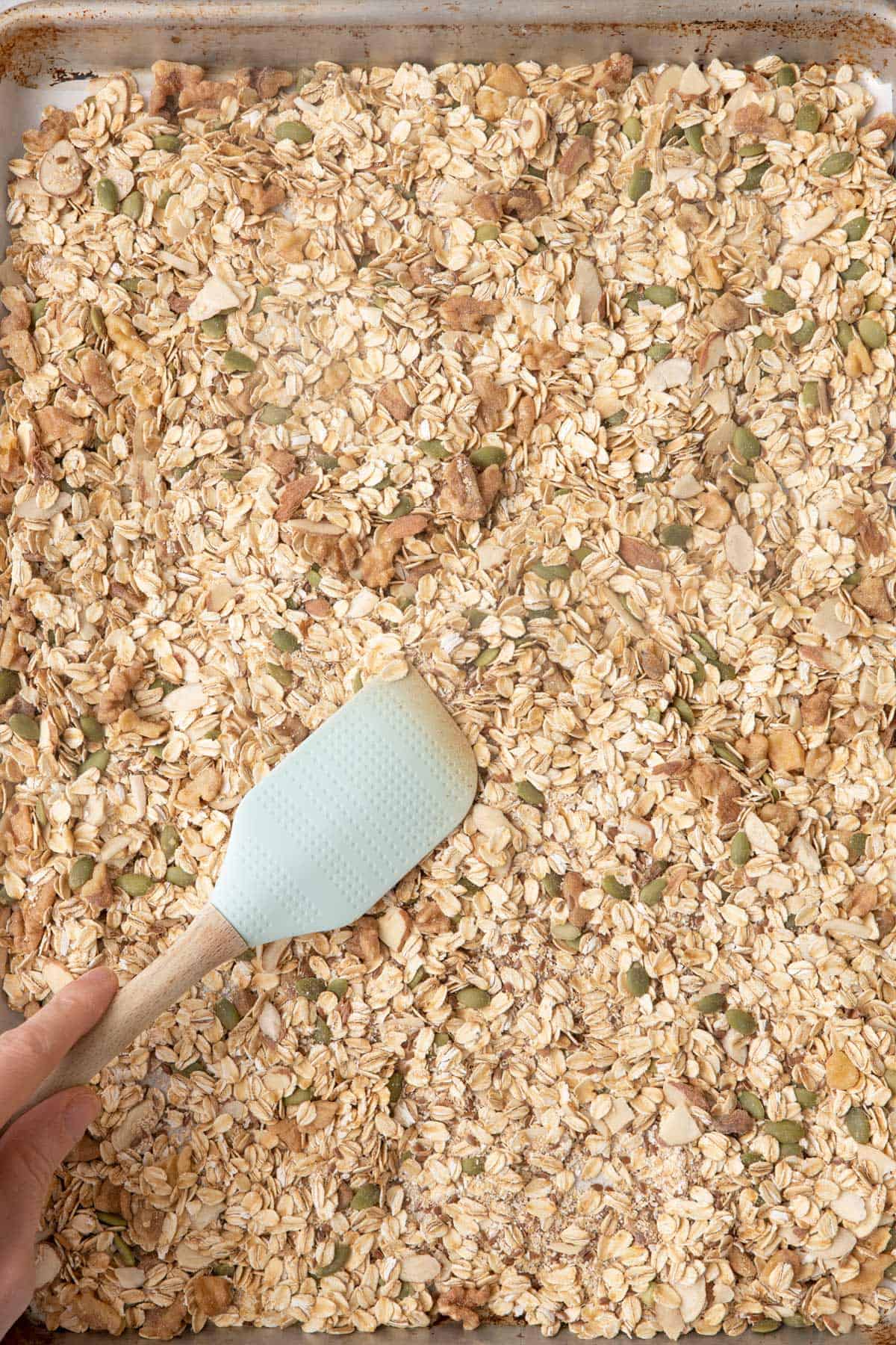 Tossing muesli before being toasted.
