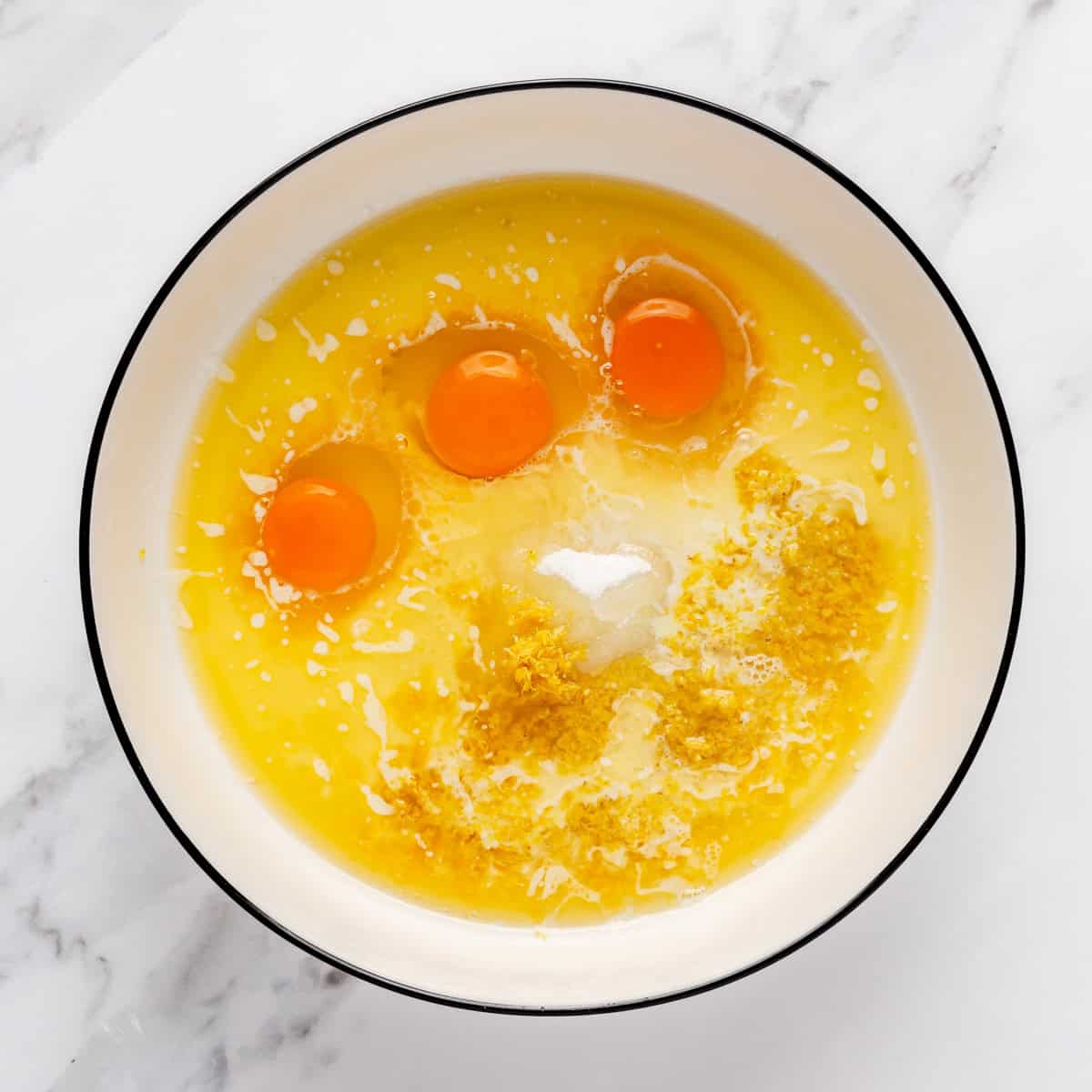 Wet ingredients added to a bowl.