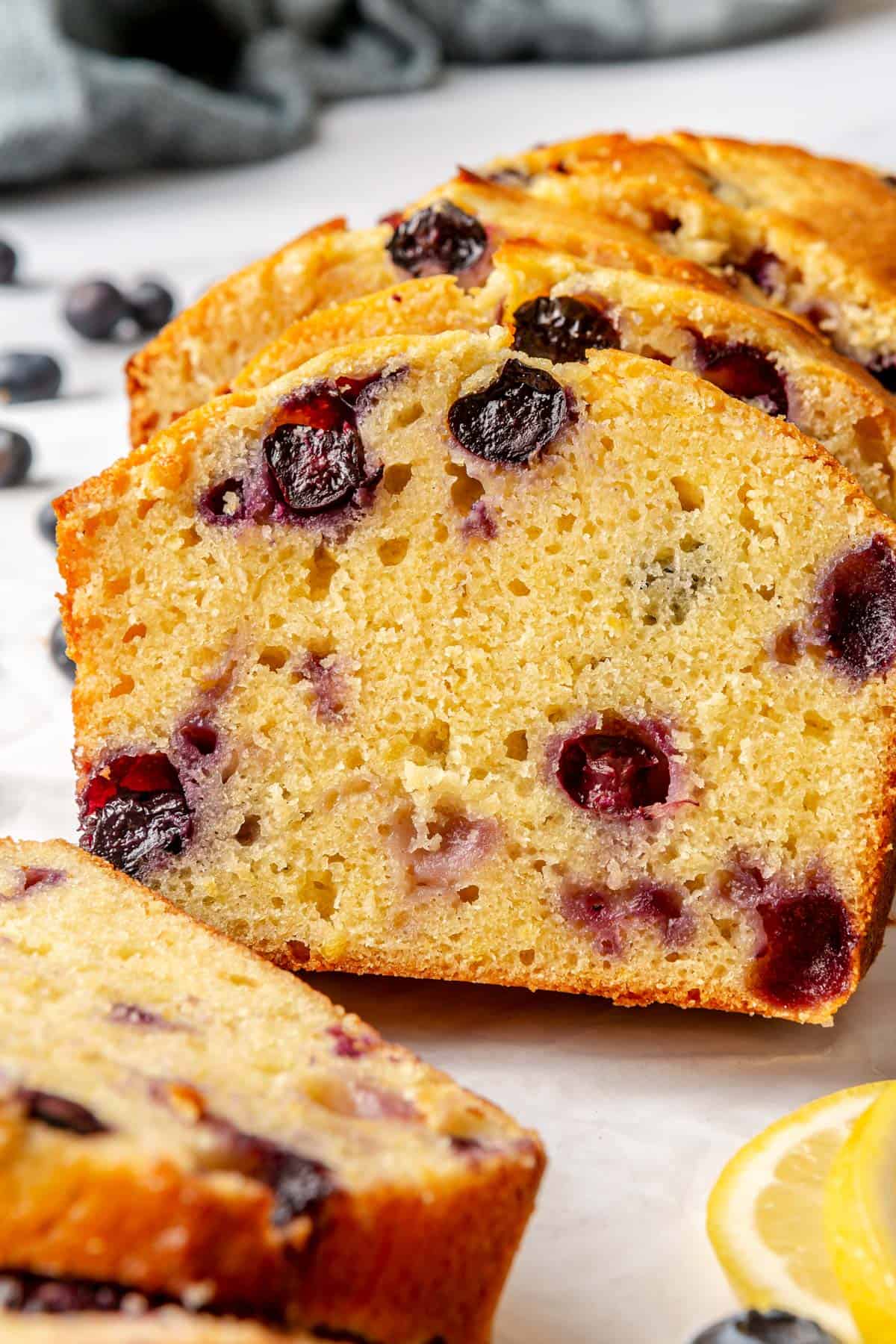 Close up of lemon blueberry bread slices to show inside texture.