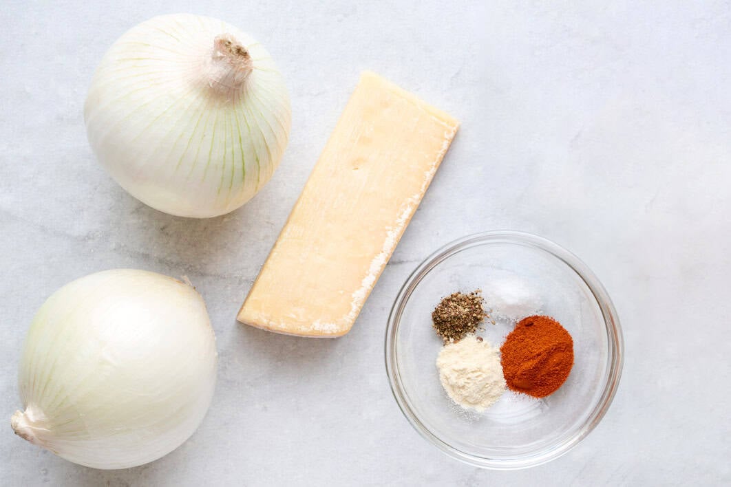 Ingredients for recipe: onions, block of parmesan cheese, spices, and avocado oil spray.