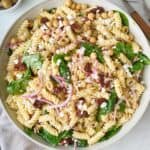 Sun-dried tomato pasta salad in a bowl.