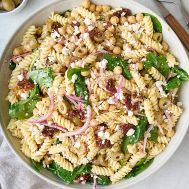 Sun-dried tomato pasta salad in a bowl.